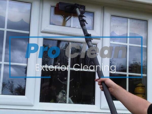 Pro Clean team performing streak-free domestic window cleaning on a home in Cannock using water-fed poles