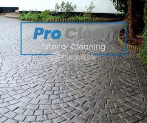 Pro Clean team performing deep drive cleaning in Cannock, removing grime and stains from block paving and concrete surfaces