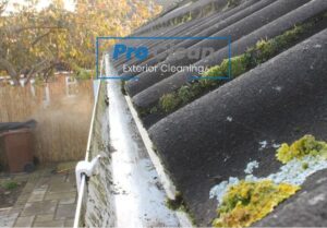 Pro Clean team using specialist equipment for gutter emptying in Cannock, removing debris and ensuring proper water flow